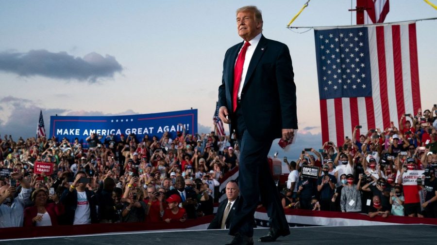 Trump walks out of his aircraft into his abundant crowd of supporters for his first rally after coronavirus.