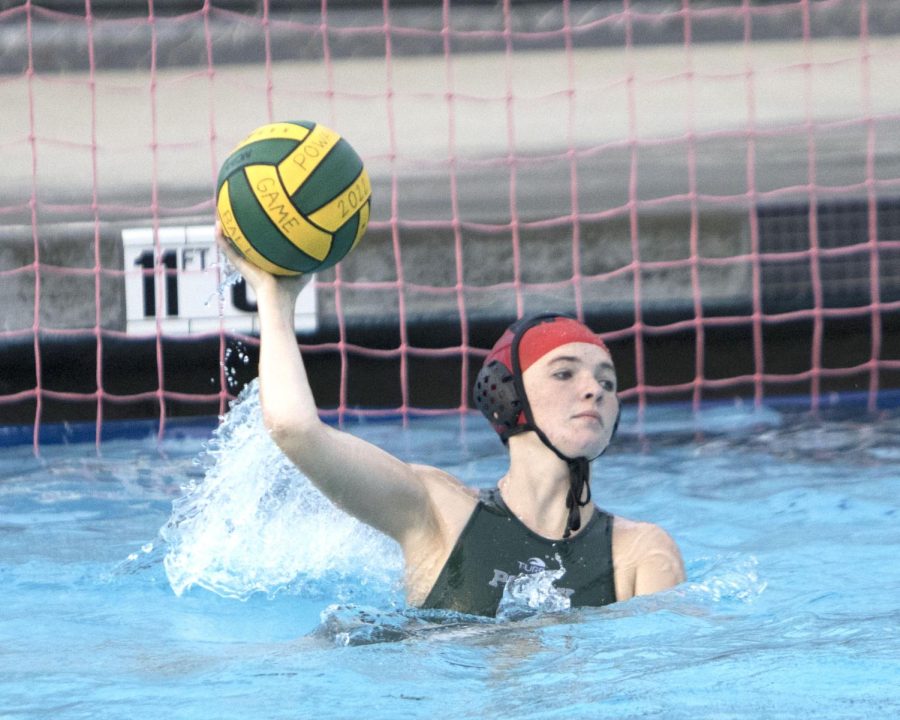 Sophomore Paige Mcfadden actively  protects the goal, keeping Fallbrook from scoring almost any points. Her defense gave her many opportunities to throw the ball up the pool and start a fast break.