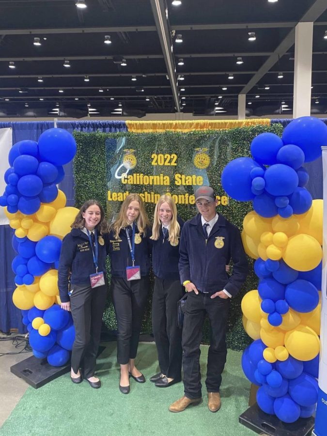(From left to right) Senior Sophia De La Vega, Senior Victoria Miller, Sophomore Jordan Smith, and Freshman Walker Sullivan pose proudly at a photo booth at the 2022 California State Leadership Conference