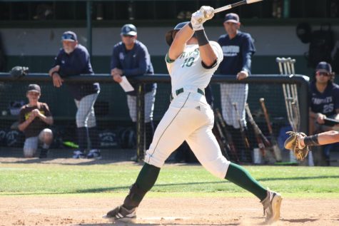 Smashing bombs: Senior Nick Cook swings at a pitch in the May 10 home league game against the San Marcos Knights.