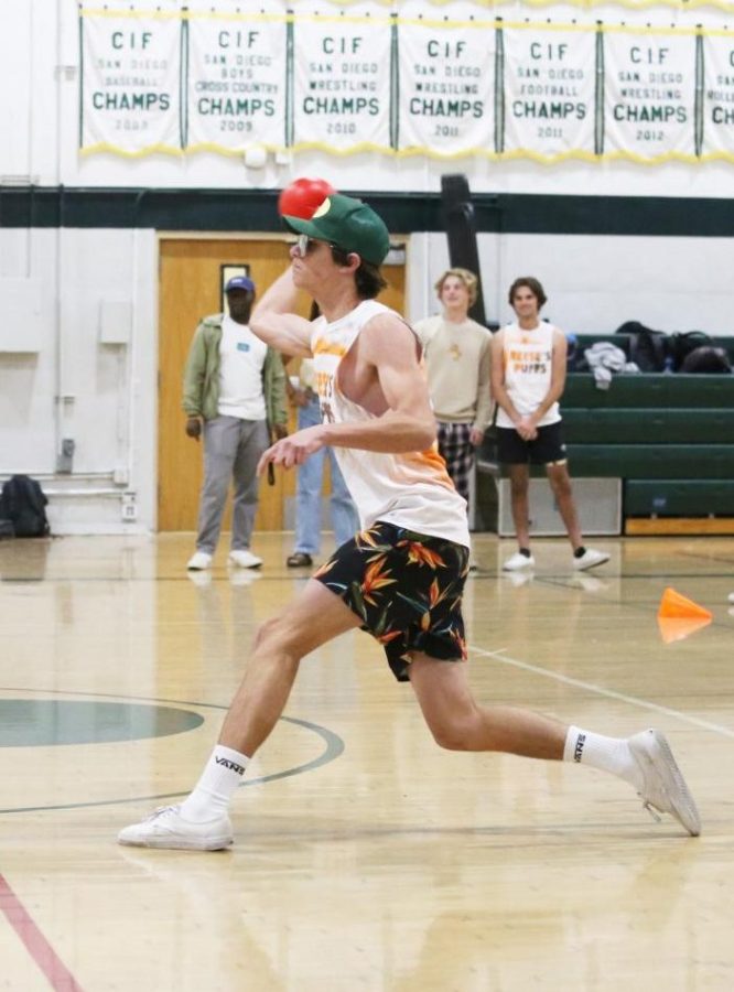 Deeply focused, junior Gavin Roy throws a ball. Roy fights hard for Team Reese’s Puffs, helping them take the victory against Team Apple Jacks.