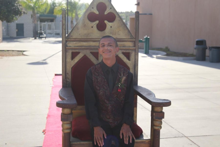 Sophomore Tavi sits on his throne before entering the prom.