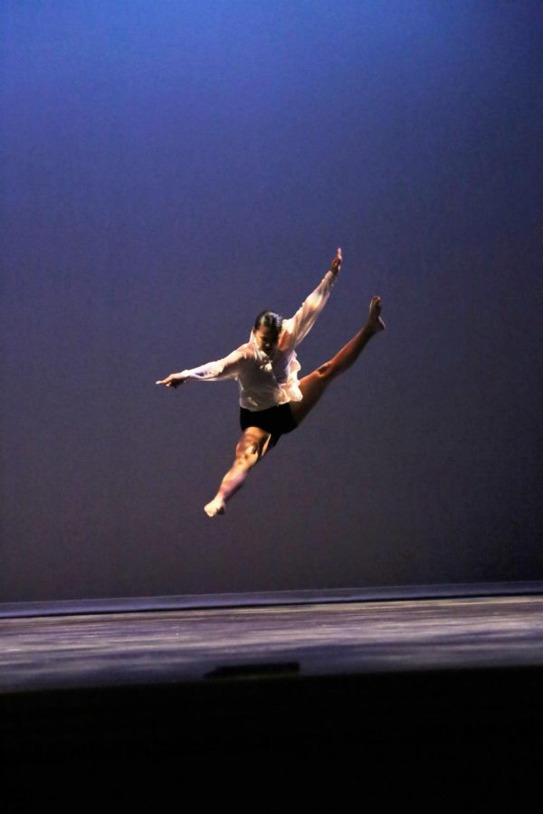 Senior Analessa Atalig jumps gracefully in her solo performance.
