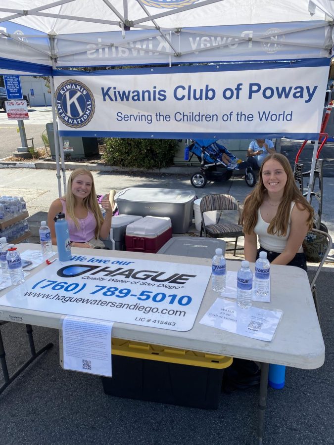 Junior Emily Harris and Jules Freeland sell water bottles for $2 to support the Kiwanis club which sponsors every key club in the district.  