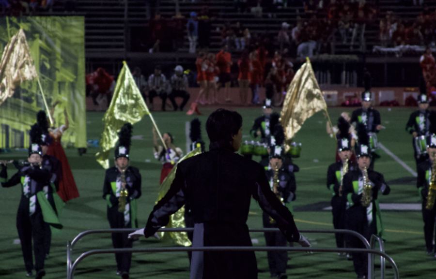 Chen directs the marching band as they perform A Disney Fantasy at halftime.