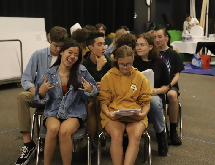 The cast runs through the boat scene, where they  cruise through the chocolate river.
Junior Natasha Panthavong, freshman Emma Avery, and seniors Daniel Hulterstrom, Elliot Husseman,  are waiting for their cue while Matilda Bowen reads her lines.
