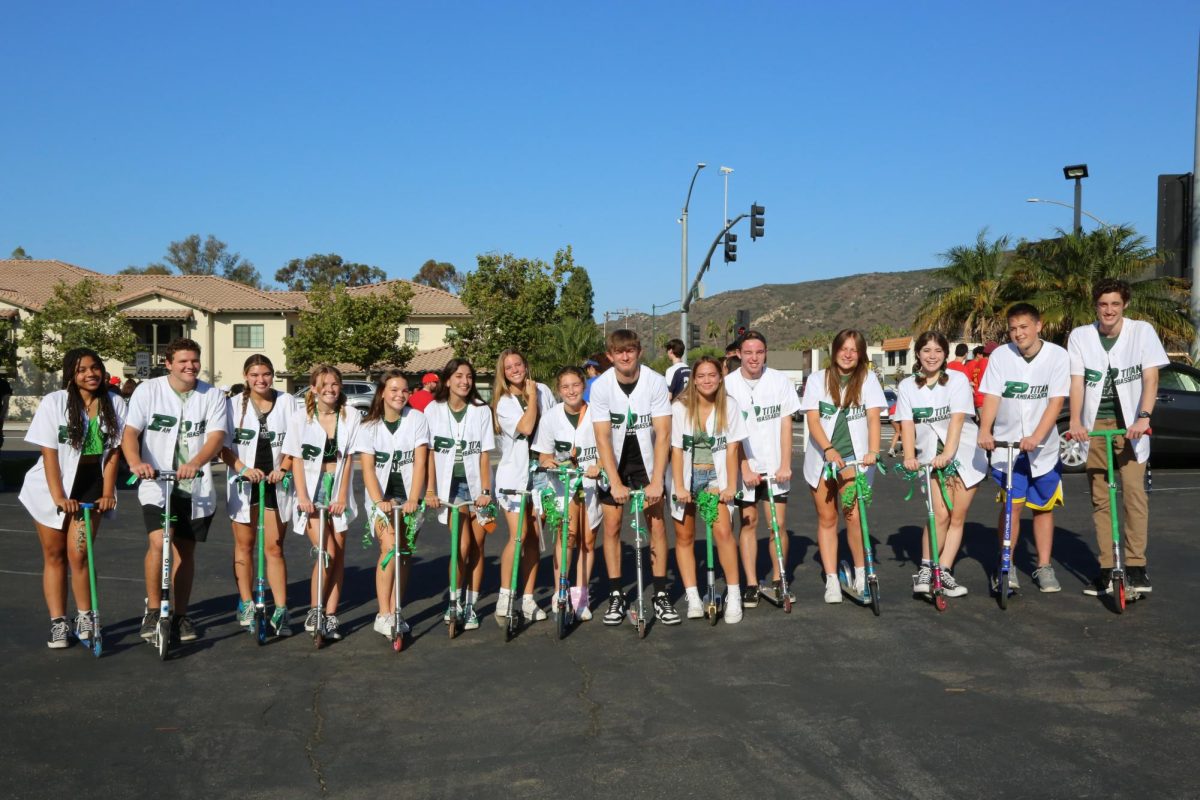 Parading through town: Titan Ambassadors ride in style at the Poway Parade on Sept. 9.