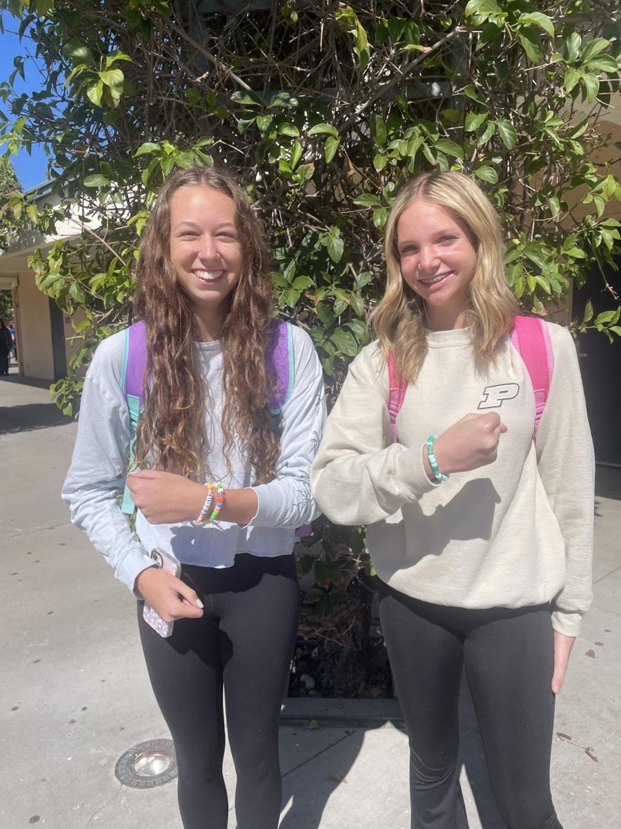 Seniors Elise Stiritz and Amber Crawford show off the friendship bracelets they made in Arts and Crafts for Mental Health.