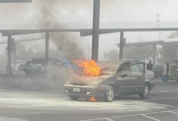 Corland Landee McIntoshs car on fire in the parking lot.