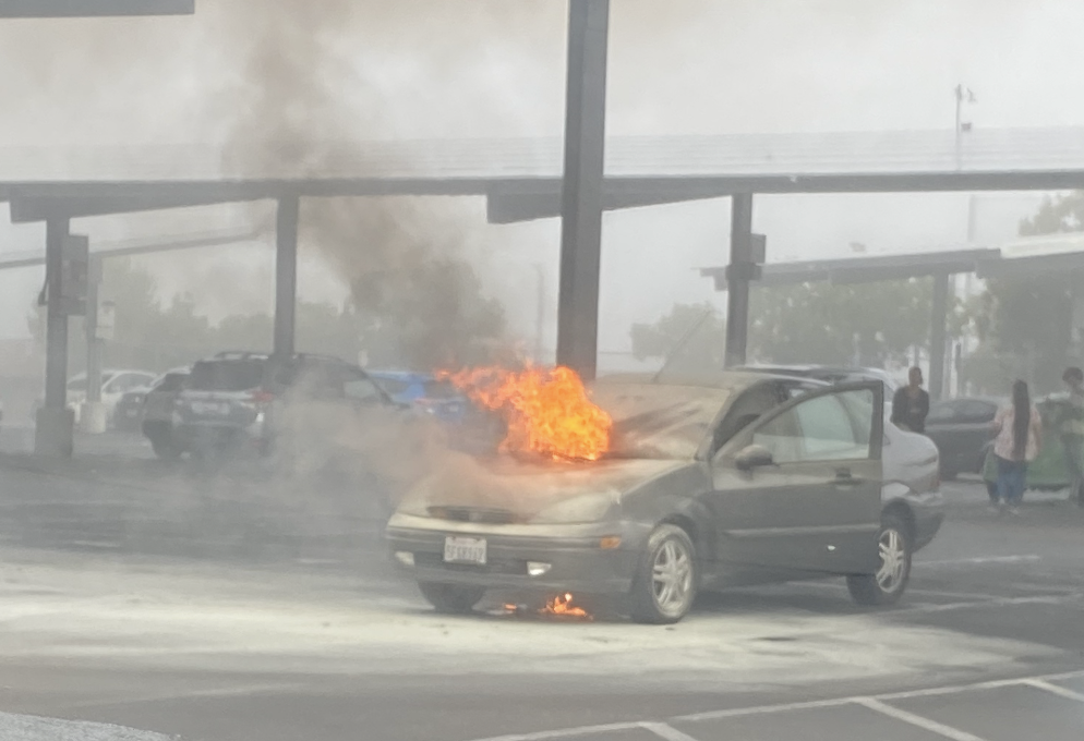 Corland+Landee+McIntoshs+car+on+fire+in+the+parking+lot.