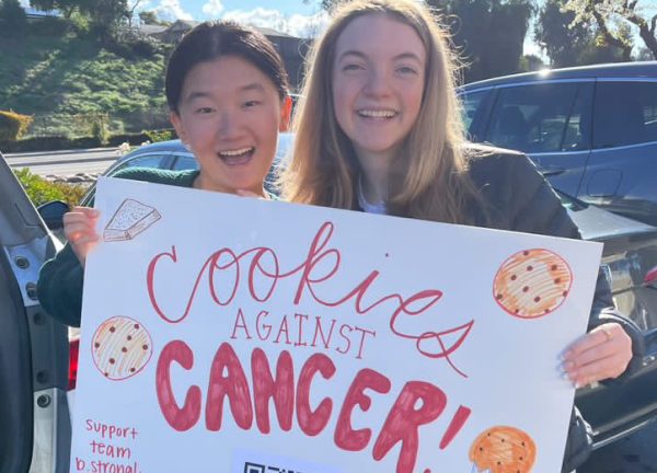 Cookies against cancer: Mt. Carmel junior Emily Kao and junior Ellie Gant hold a bake sale to raise money for the Lymphoma and Leukimia Society.