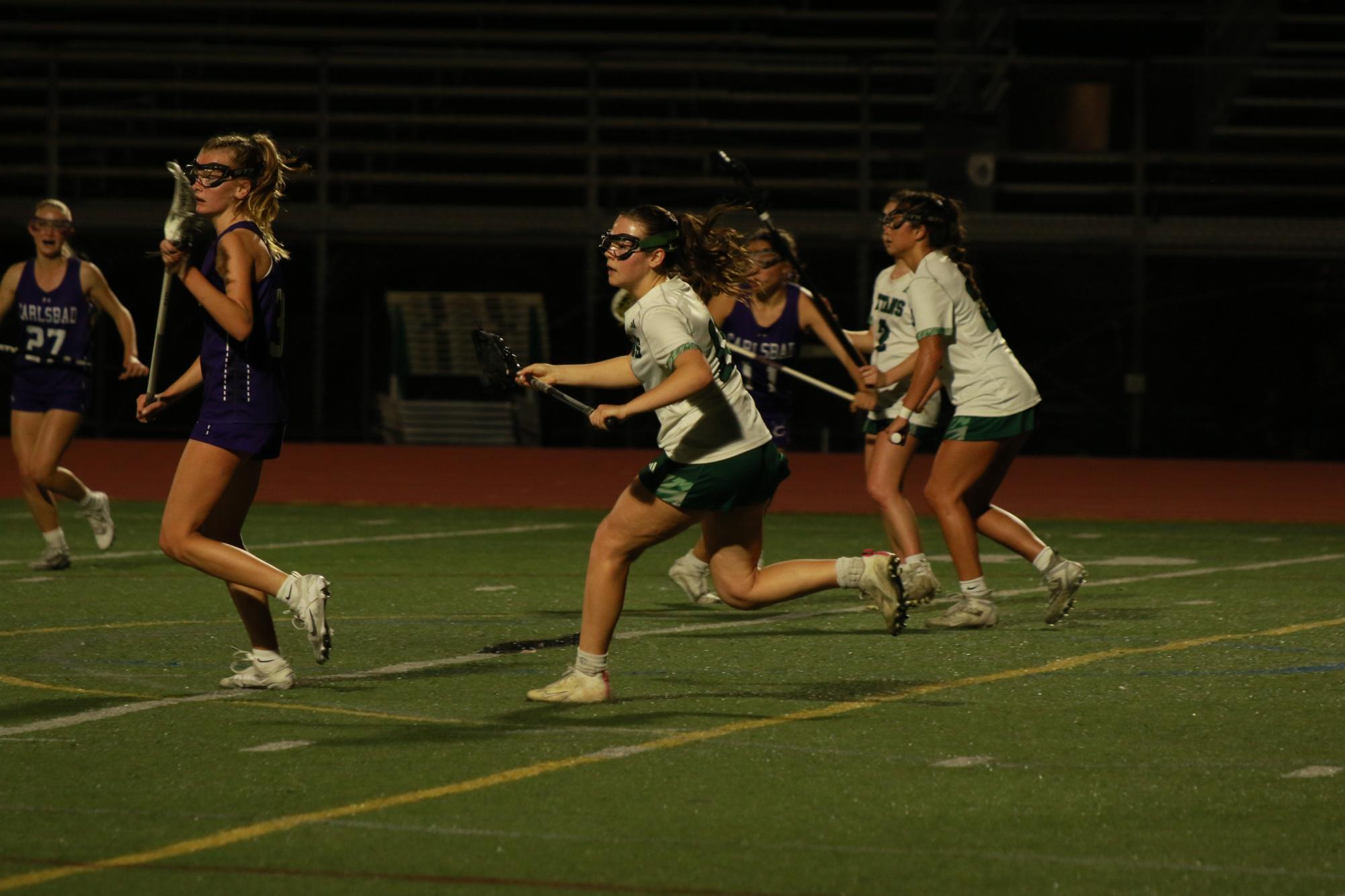 Senior Lydia Manly rushes toward the ball.