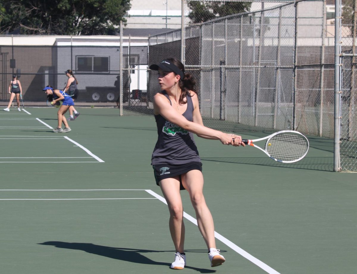 Junior Amelie Schlierf prepares to send the ball back to her opponent. 