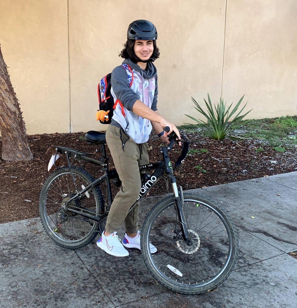 Senior Boris Ivanov prepares to leave school on his e-bike.