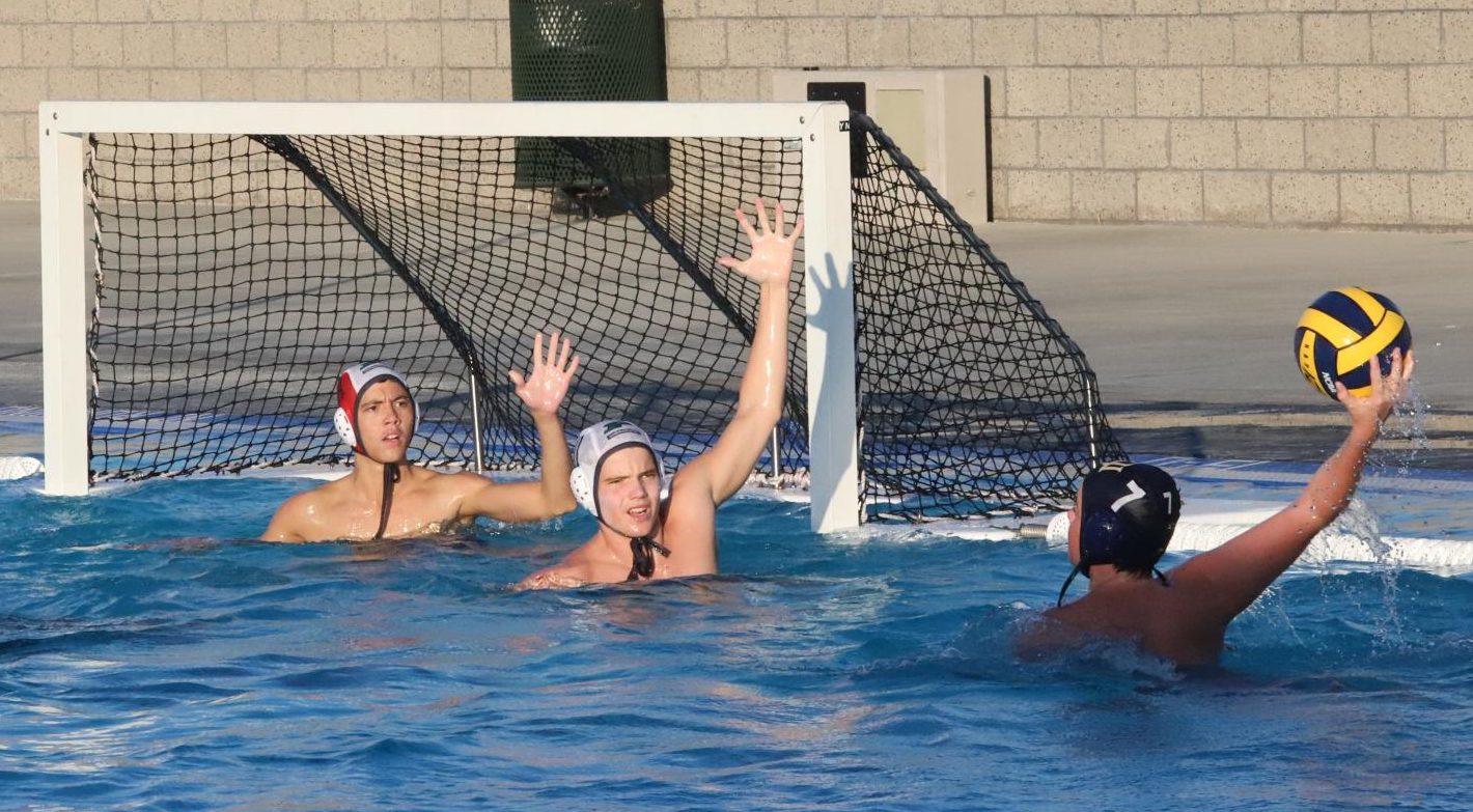 Sophomore Max Kellerman and Logan Rorye try to block Del Norte from scoring. Poway beat Del Norte 16 - 8 on Sept. 20.                                                                