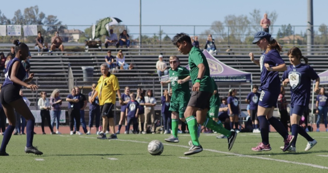 Senior Brandan Manolack dribbles the ball down the field in hopes of scoring.