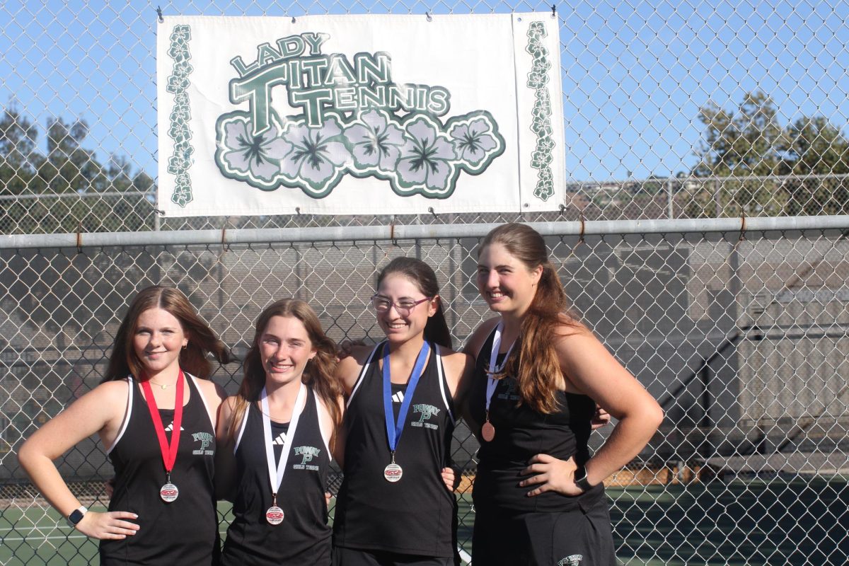 Racking it up: Freshman Kailey Long, Junior Alexy Gonda, senior Julie Chavez, and junior Emily Farr Show of there Medals for Single and doubles.