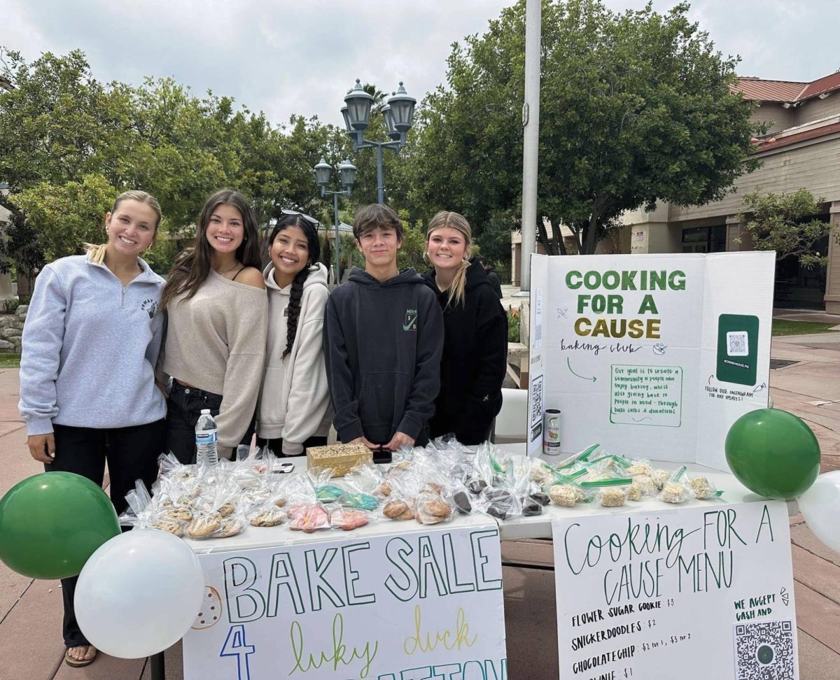 Whisking Up Change: Big smiles welcome locals in Poway Plaza to buy some sweet treats to raise money for the homeless people.      