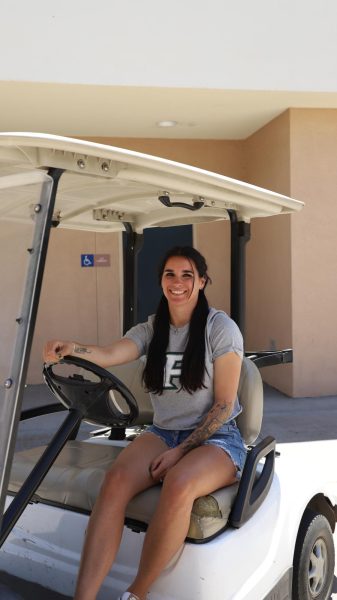 Parked and patrolling: Tori Ornela smiles while keeping an eye on the front gate of the campus.
