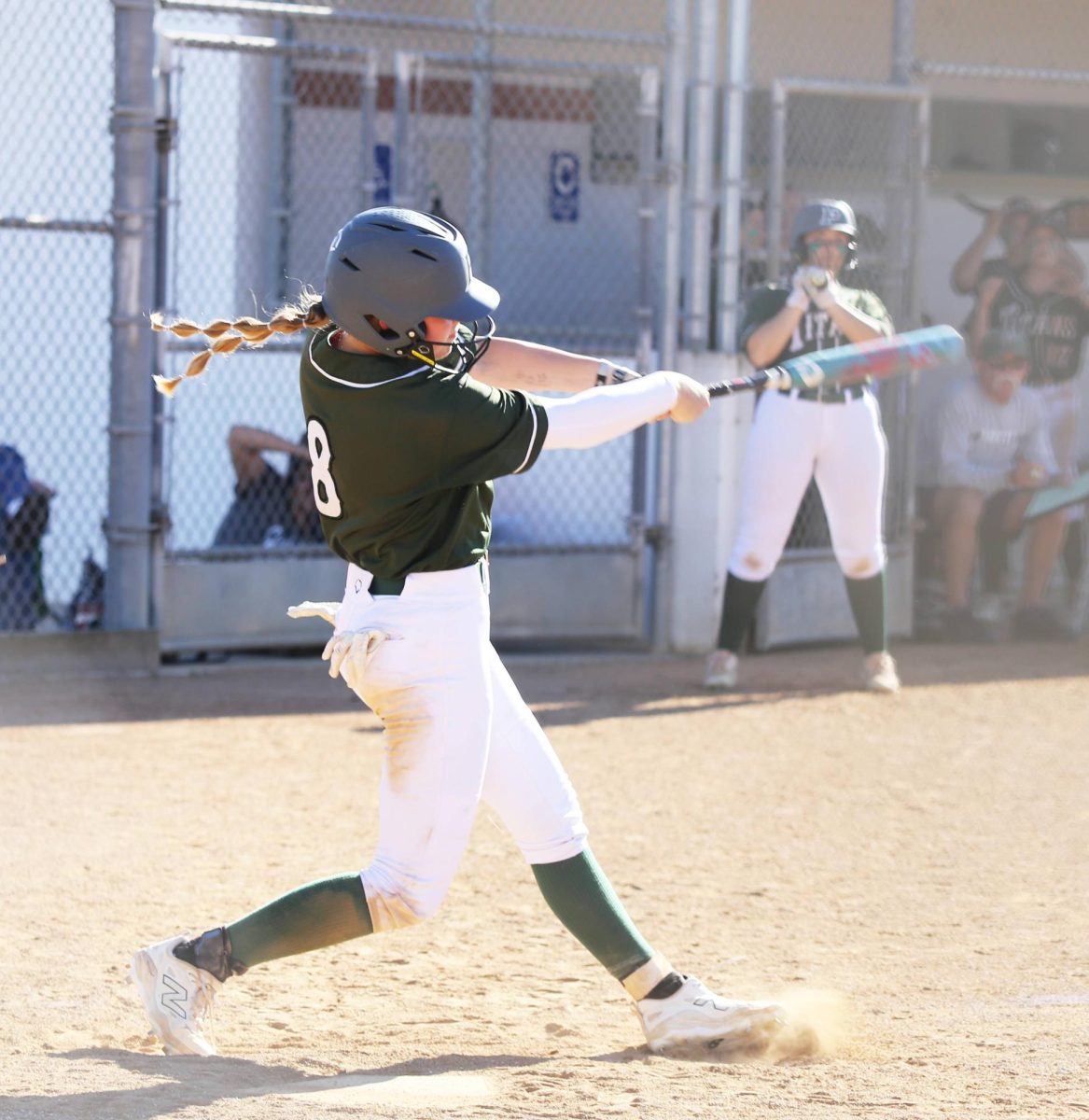 Freshman Payton Videno swings her bat perfectly hitting the ball.
