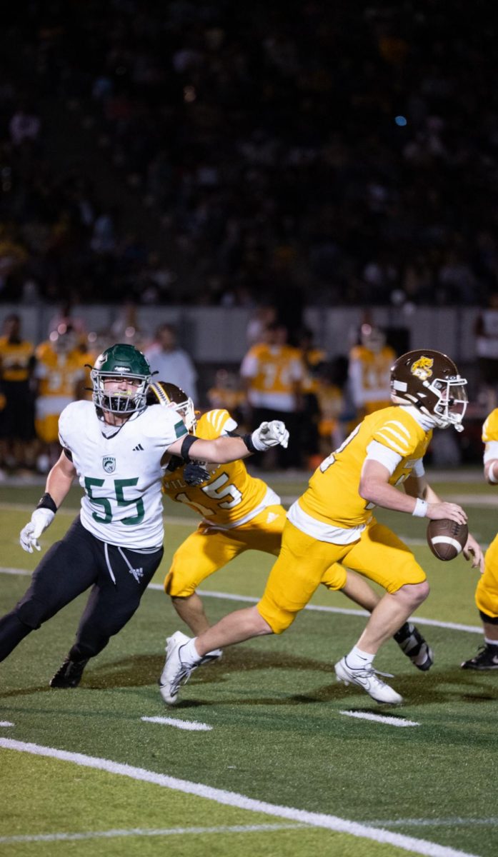 Just keep running: Seniors Colin Raibert and Luke Jorgensen play against 2-4, El Camino High School on Oct. 3, demolishing them 52-28
