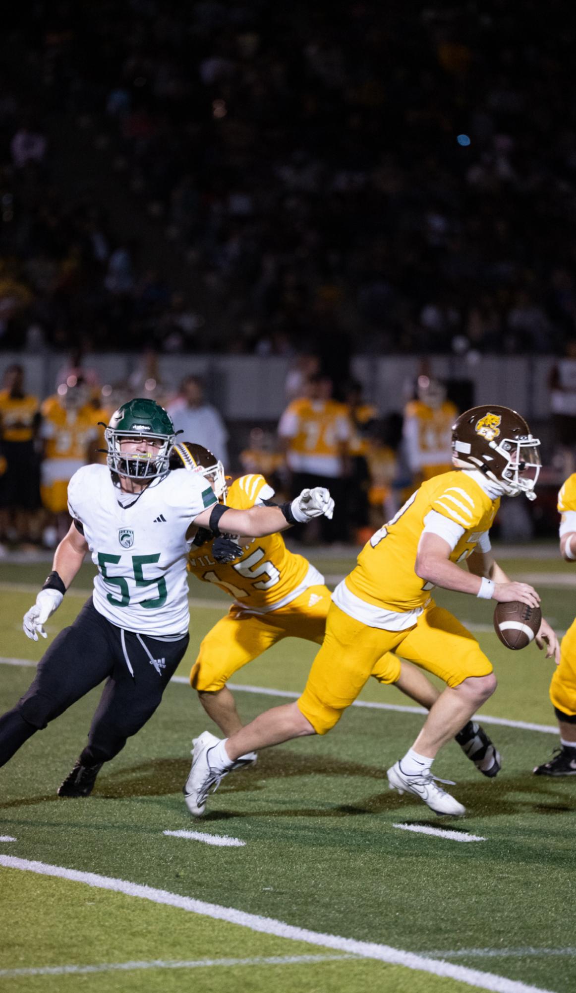 Just keep running: Seniors Colin Raibert and Luke Jorgensen play against 2-4, El Camino High School on Oct. 3, demolishing them 52-28