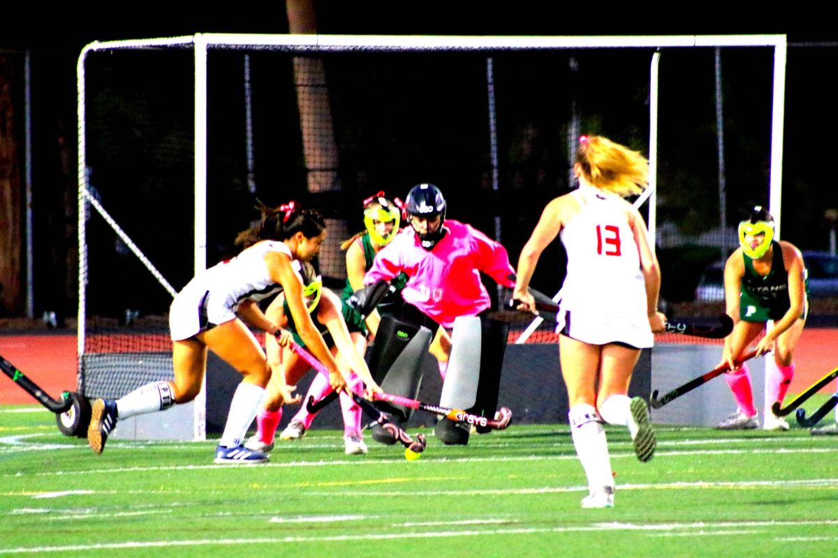 Junior goalie Rochelle Ruiz blocks the ball from a Raven