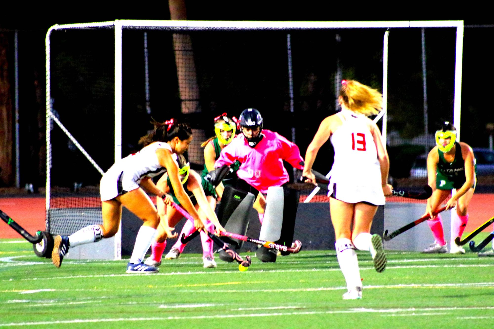 Junior goalie Rochelle Ruiz blocks the ball from a Raven