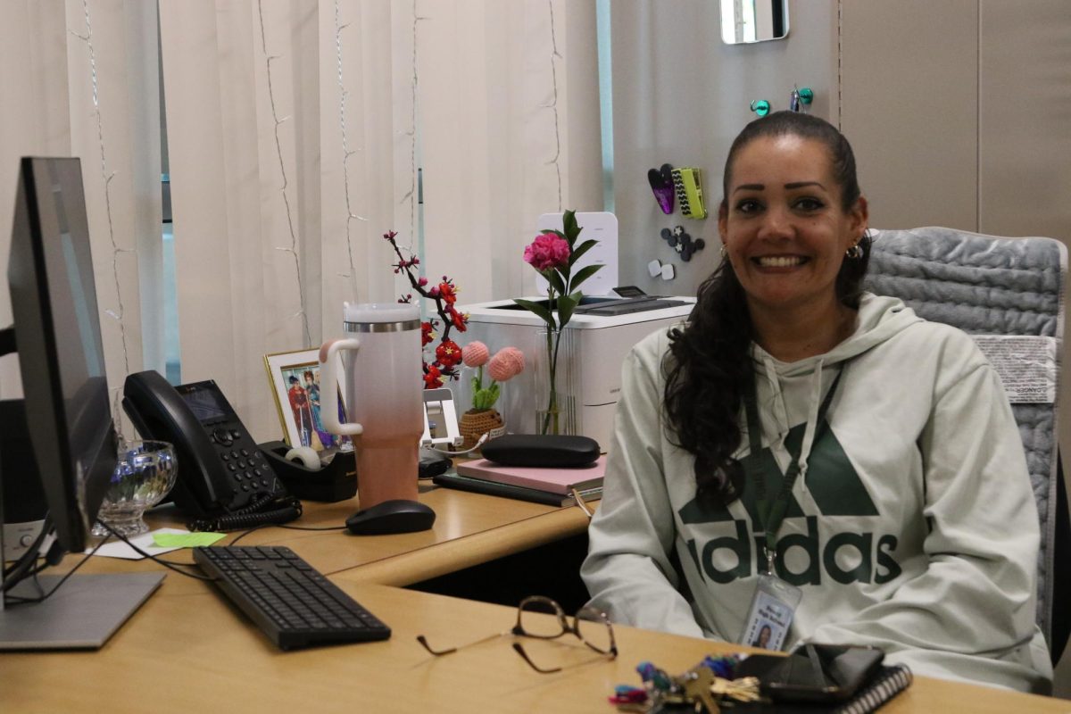 Ayurelia Bea sits proudly at her new student Support desk. 